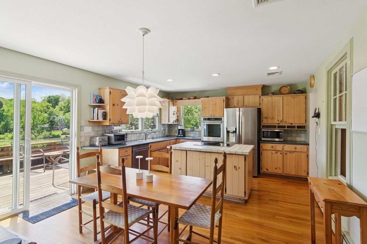 Dining room, Interior, Kitchen, Pendant Lights, Recessed Lighting, Stainless Steel Appliances, Wood Texture Flooring