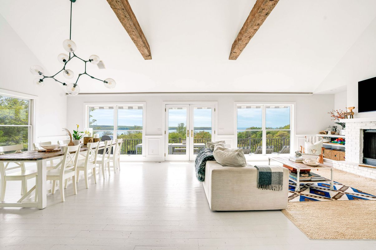 Dining room, Fireplace, Interior, Living room, Pendant Lights, Water, Wooden Beams, Wood Texture Flooring