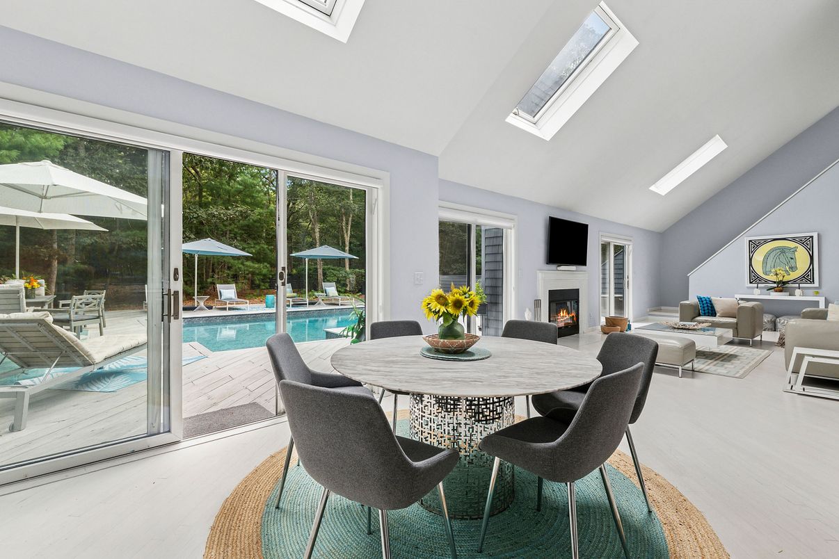 Dining room, Fireplace, Interior, Living room, Pool, Wood Texture Flooring