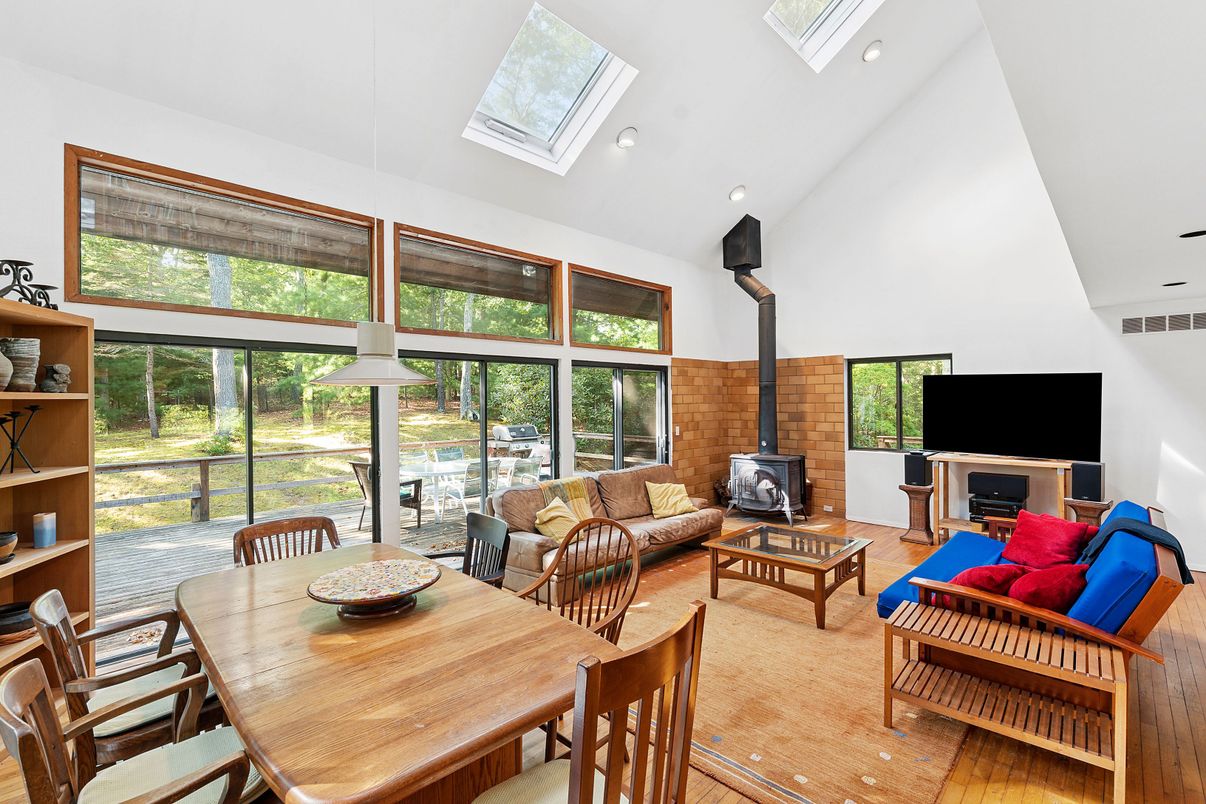 Dining room, Fireplace, Interior, Living room, Pendant Lights, Recessed Lighting, Stone Walls, Wood Texture Flooring