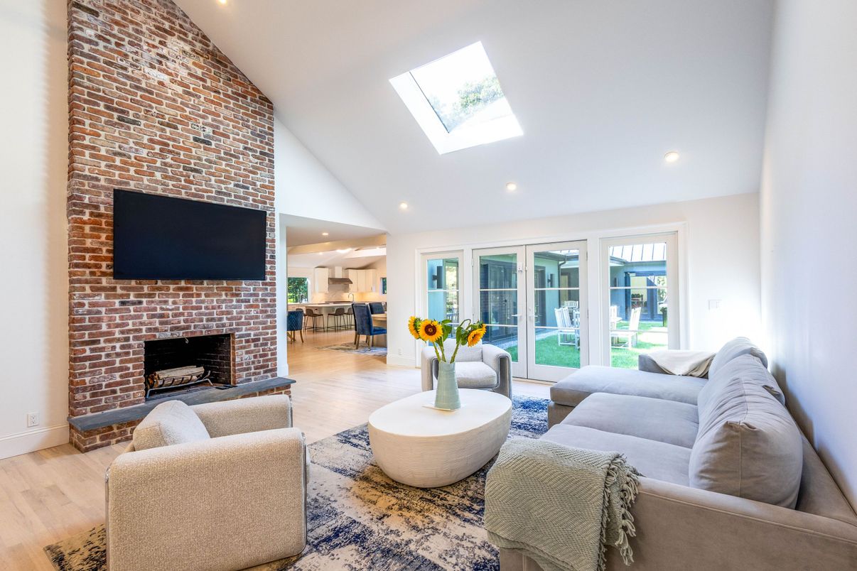 Fireplace, Interior, Living room, Recessed Lighting, Stone Walls, Wood Texture Flooring