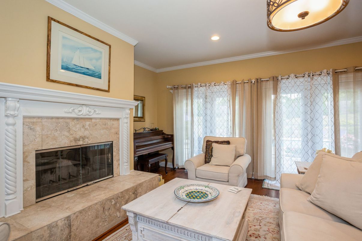 Fireplace, Interior, Living room, Piano, Recessed Lighting, Wood Texture Flooring