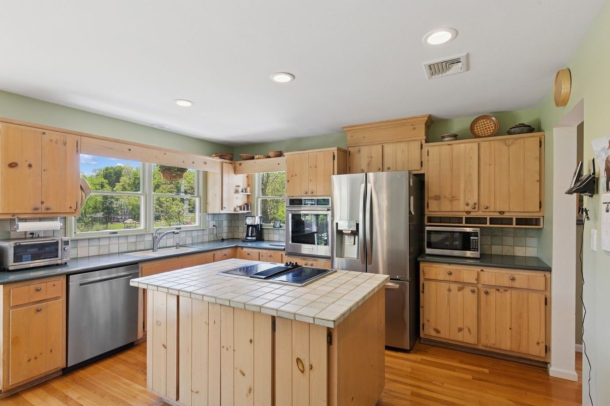 Interior, Kitchen, Recessed Lighting, Stainless Steel Appliances, Tile Countertops, Wood Texture Flooring