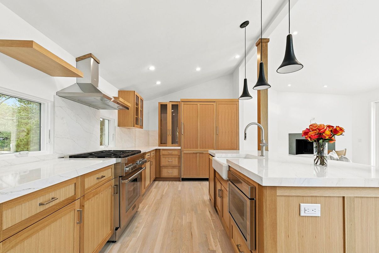 Interior, Kitchen, Marble Walls, Pendant Lights, Recessed Lighting, Stainless Steel Appliances, Wood Texture Flooring