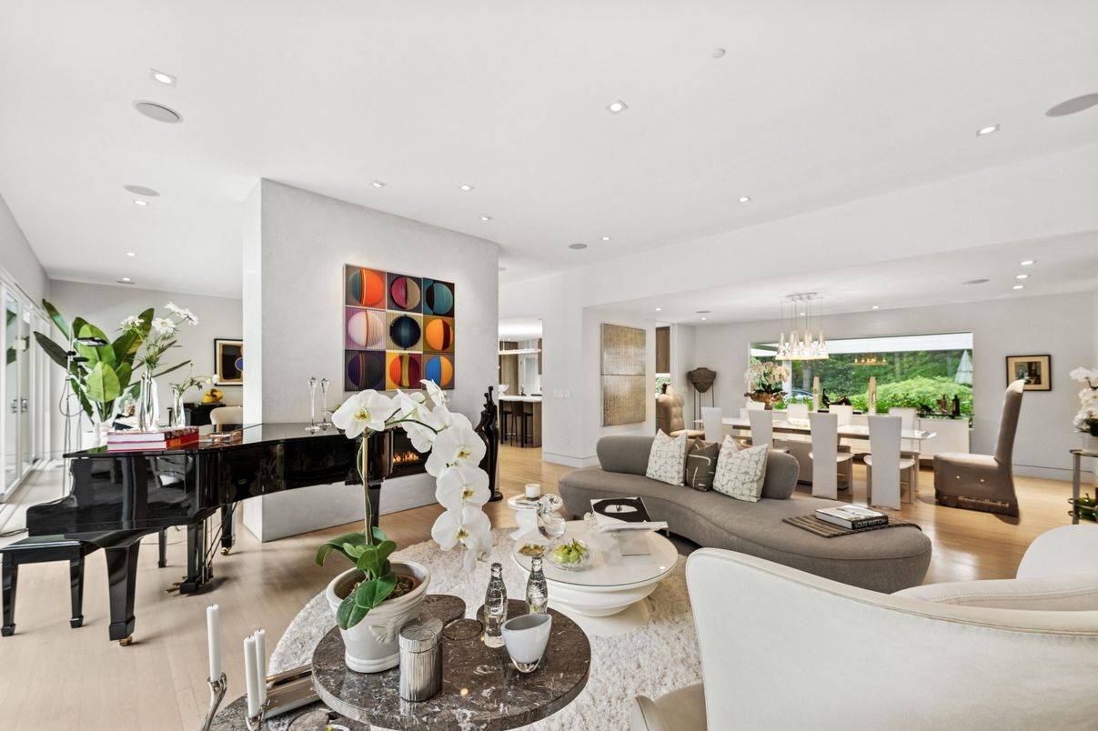 Chandelier, Dining room, Fireplace, Interior, Living room, Piano, Recessed Lighting, Wood Texture Flooring