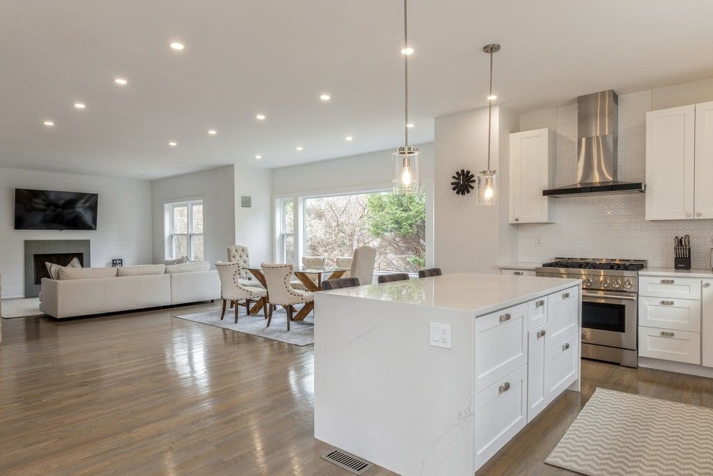 Dining room, Fireplace, Interior, Kitchen, Living room, Pendant Lights, Recessed Lighting, Stainless Steel Appliances, Wood Texture Flooring