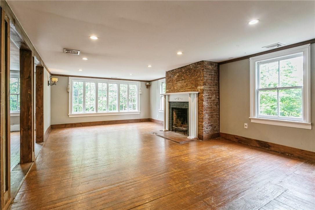 Empty room, Fireplace, Interior, Recessed Lighting, Stone Walls, Wood Texture Flooring