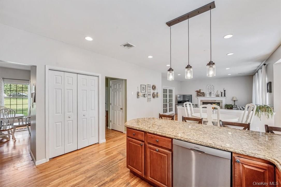 Dining room, Fireplace, Interior, Kitchen, Pendant Lights, Recessed Lighting, Wood Texture Flooring