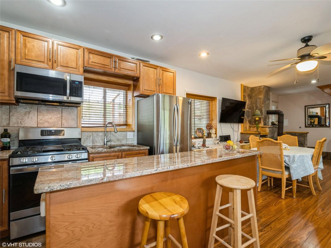 Dining room, Interior, Kitchen, Recessed Lighting, Stainless Steel Appliances, Wood Texture Flooring