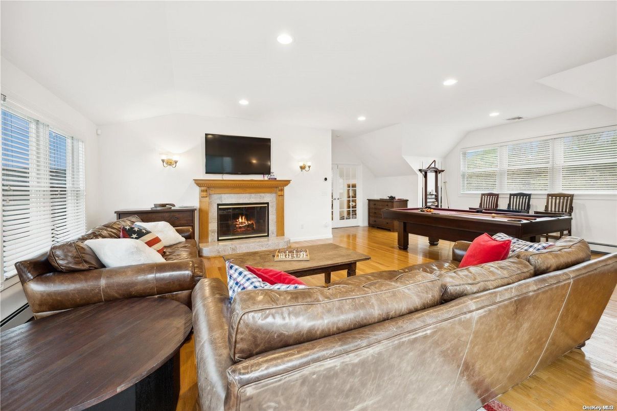 Billiard Table, Fireplace, Game Room, Interior, Living room, Recessed Lighting, Wood Texture Flooring