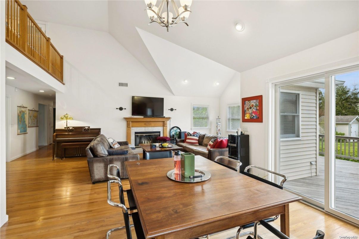 Chandelier, Dining room, Fireplace, Interior, Living room, Recessed Lighting, Wood Texture Flooring