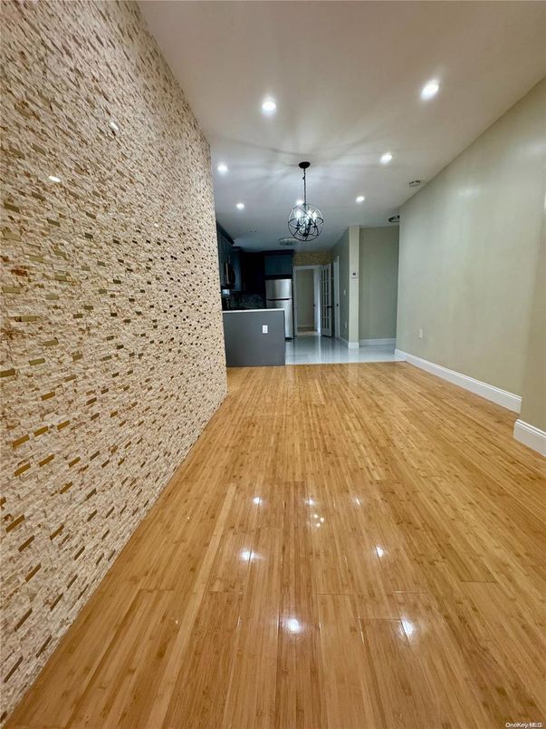 Chandelier, Empty room, Interior, Kitchen, Recessed Lighting, Stainless Steel Appliances, Wood Texture Flooring