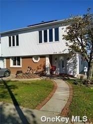 Attached, Backyard, Exterior, Facade, Brick Facade, Raised Ranch