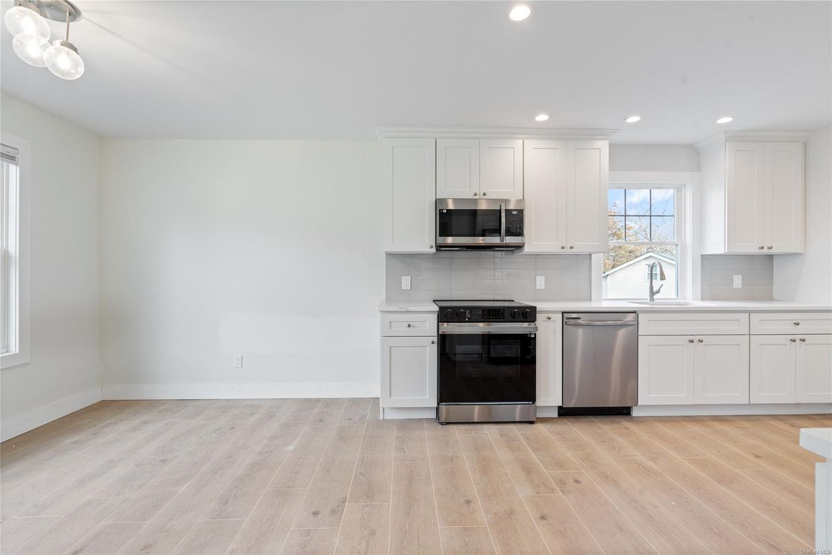 Interior, Kitchen, Recessed Lighting, Stainless Steel Appliances, Wood Texture Flooring