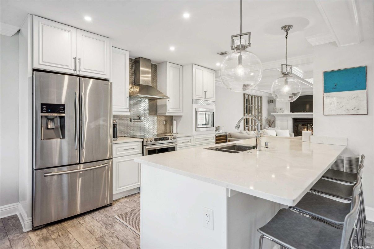 Fireplace, Interior, Kitchen, Pendant Lights, Recessed Lighting, Stainless Steel Appliances, Wood Texture Flooring