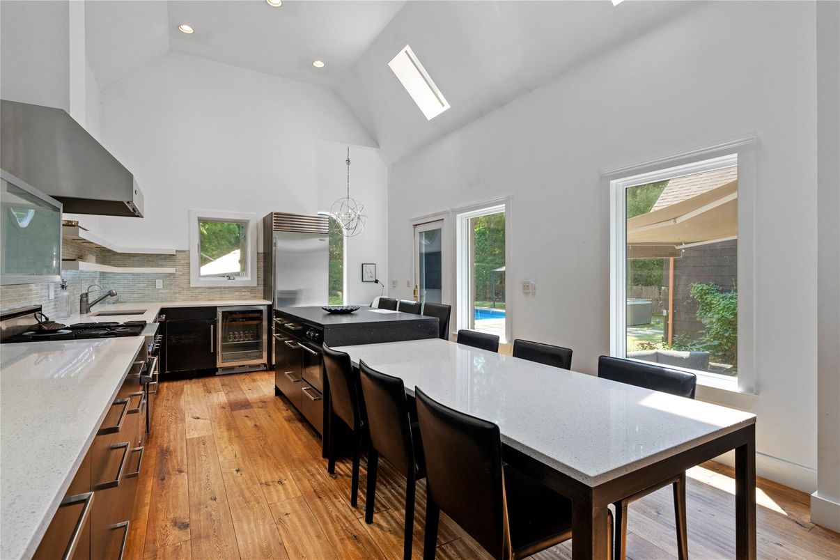Dining room, Interior, Kitchen, Pendant Lights, Recessed Lighting, Stainless Steel Appliances, Wood Texture Flooring