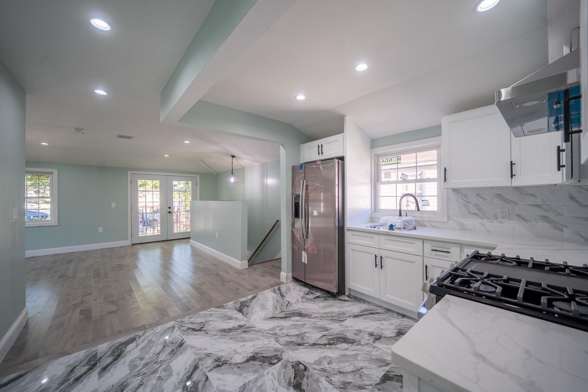 Interior, Kitchen, Marble, Marble Walls, Recessed Lighting, Stainless Steel Appliances, Wood Texture Flooring