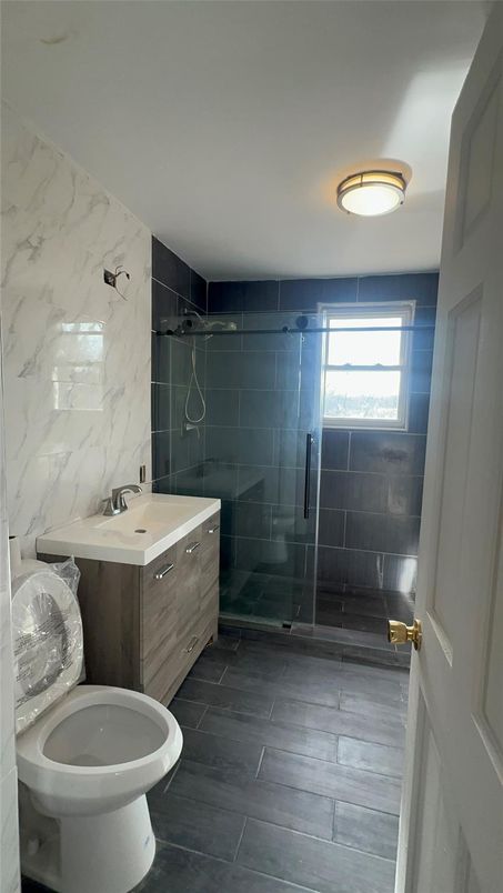 Bathroom, Glass Shower, Interior, Marble Walls, Wood Texture Flooring