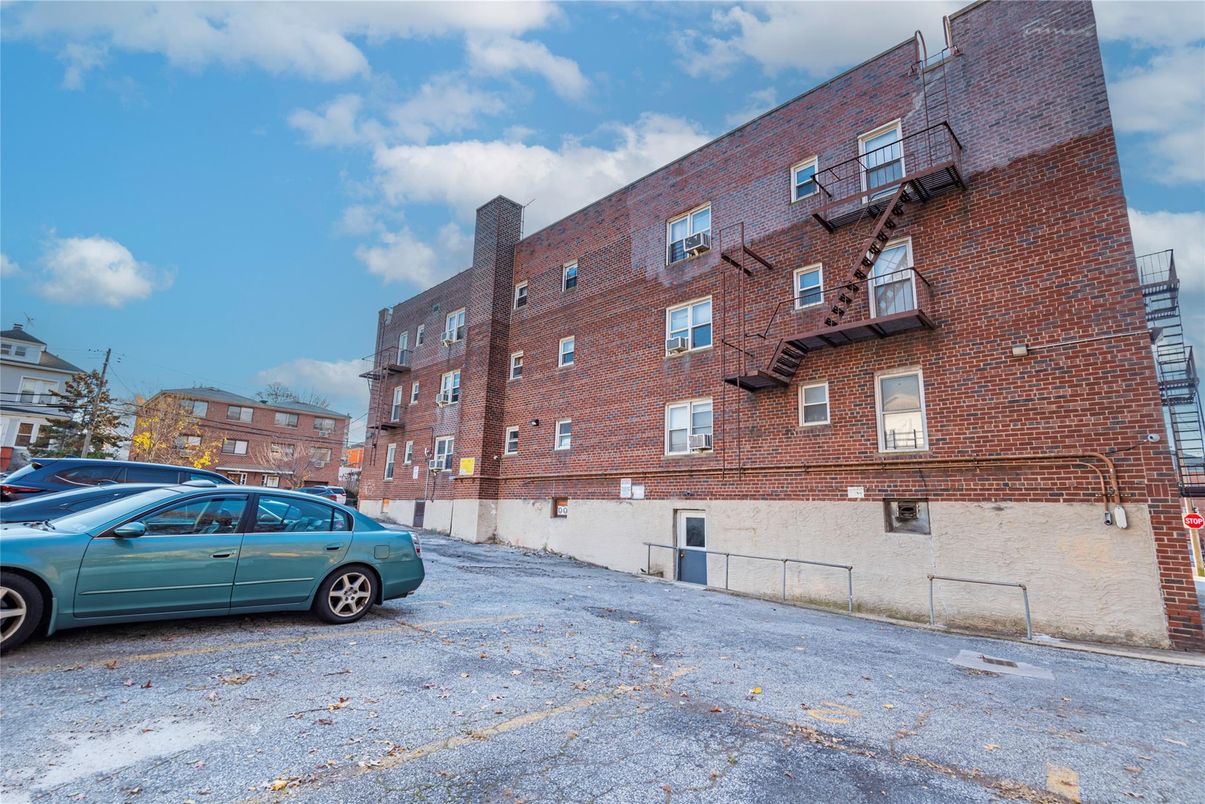 Exterior, Facade, Brick Facade, Condo Building