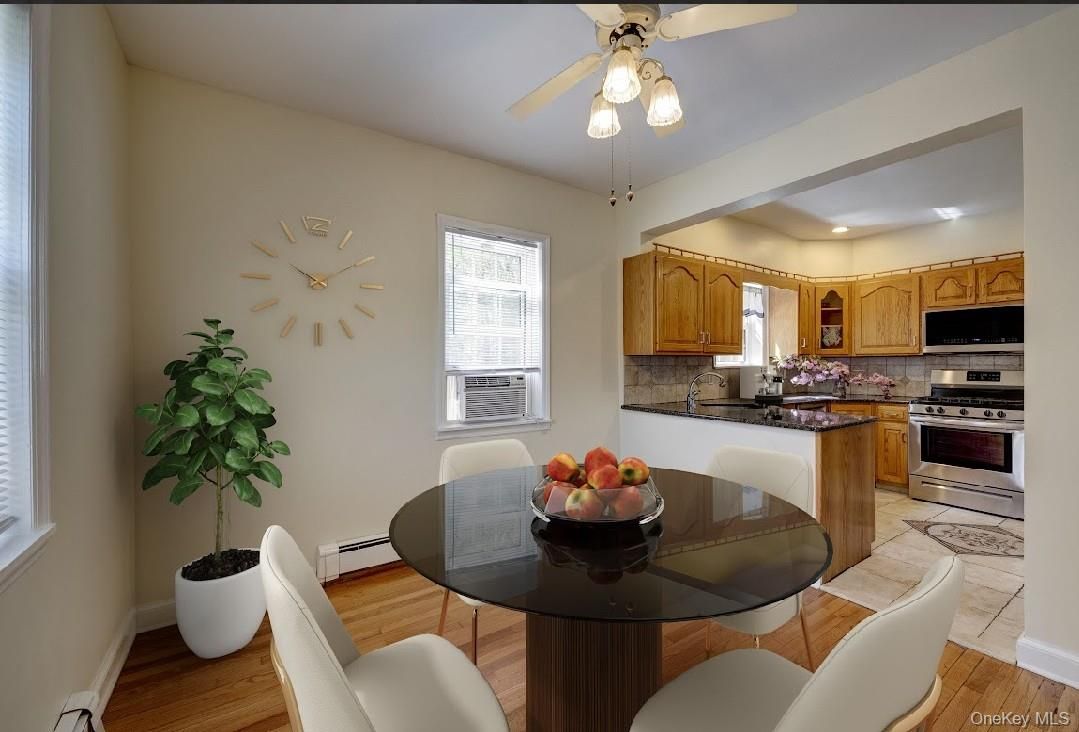 Dining room, Interior, Kitchen, Recessed Lighting, Stainless Steel Appliances, Wood Texture Flooring