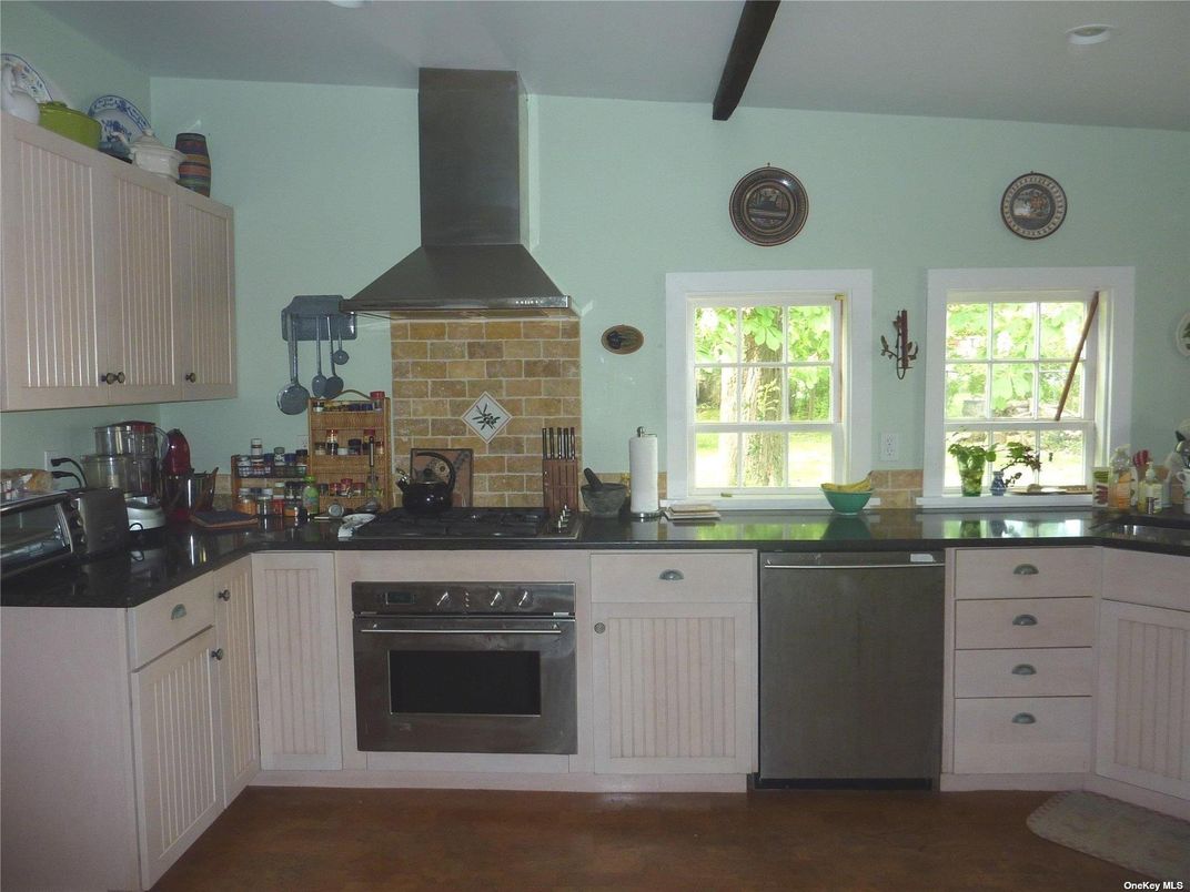 Fireplace, Interior, Kitchen, Recessed Lighting, Stainless Steel Appliances, Stone Walls, Wood Texture Flooring
