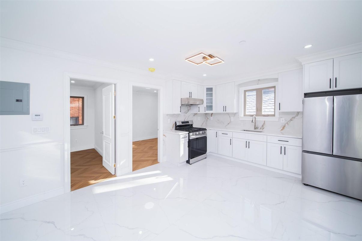Interior, Kitchen, Marble, Marble Walls, Recessed Lighting, Stainless Steel Appliances, Wood Texture Flooring