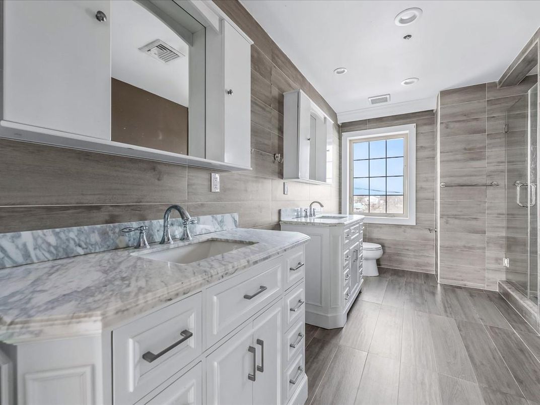 Bathroom, Dual Sink Vanities, Glass Shower, Interior, Recessed Lighting, Wood Texture Flooring