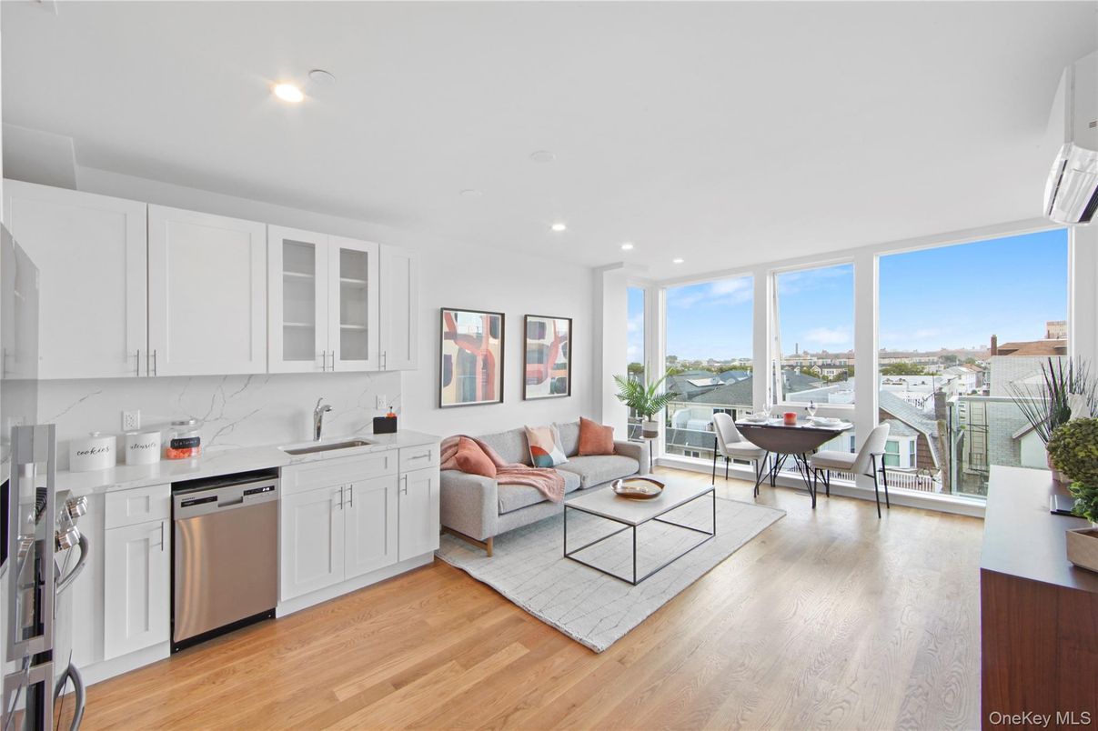 Dining room, Interior, Kitchen, Living room, Recessed Lighting, Stainless Steel Appliances, Water, Wood Texture Flooring