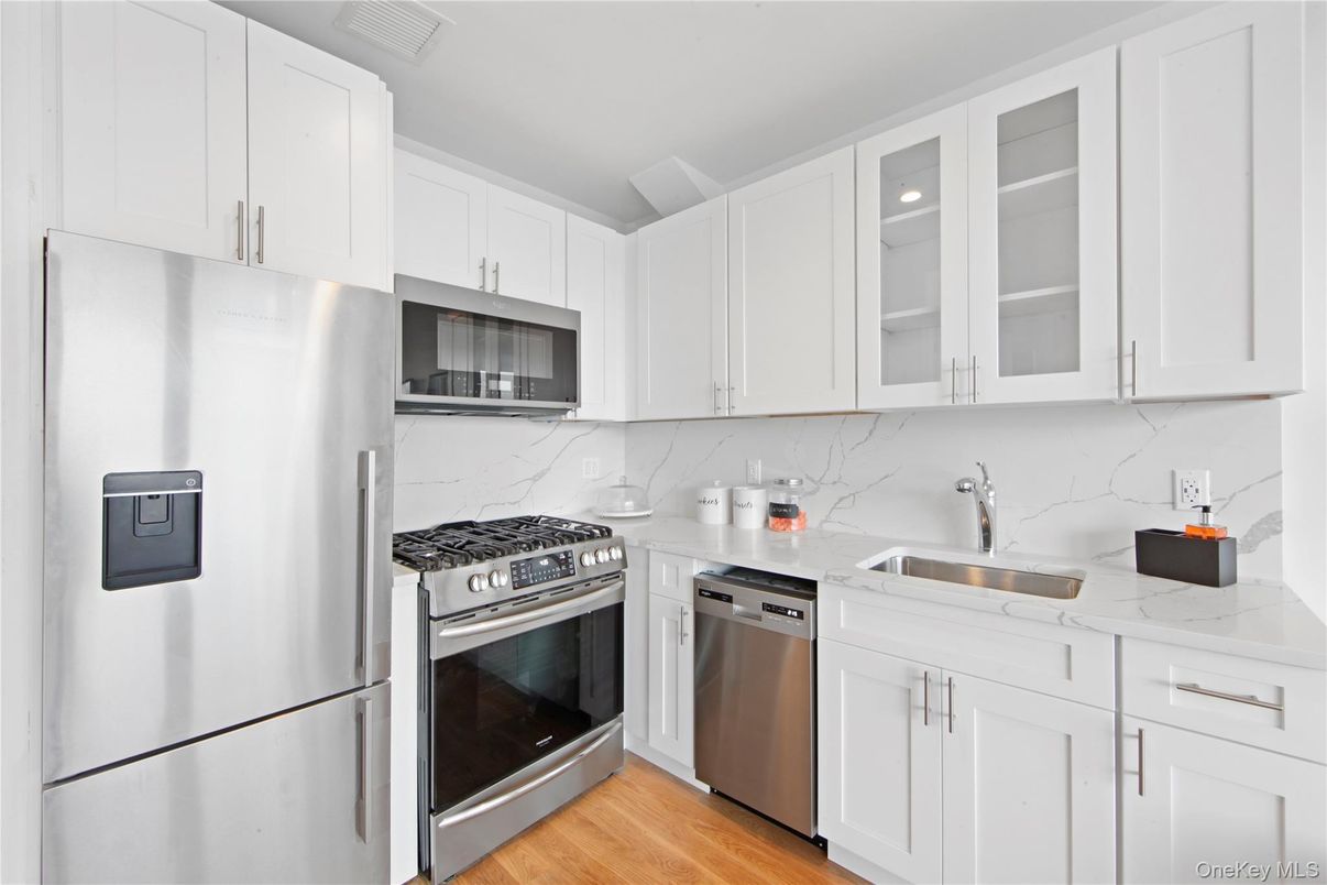 Interior, Kitchen, Marble Walls, Stainless Steel Appliances, Wood Texture Flooring