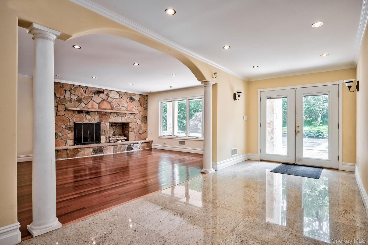 Empty room, Fireplace, Interior, Recessed Lighting, Stone Walls, Wood Texture Flooring