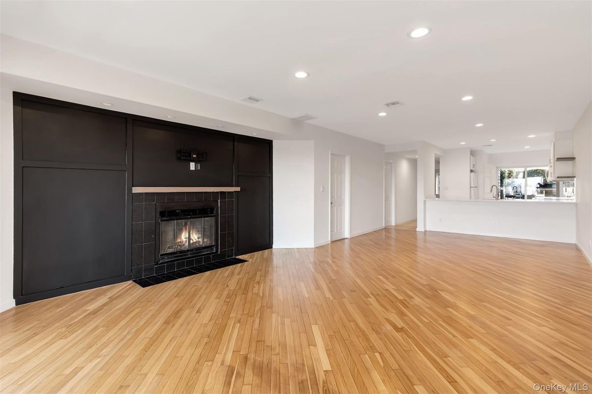 Empty room, Fireplace, Interior, Kitchen, Recessed Lighting, Wood Texture Flooring
