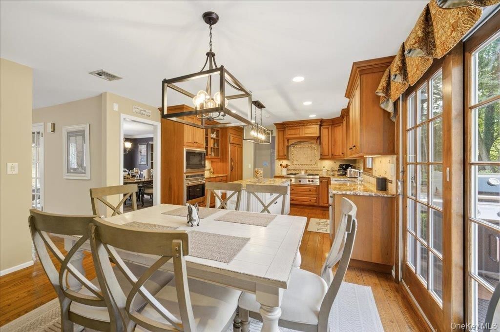 Dining room, Interior, Kitchen, Pendant Lights, Recessed Lighting, Stainless Steel Appliances, Wood Texture Flooring
