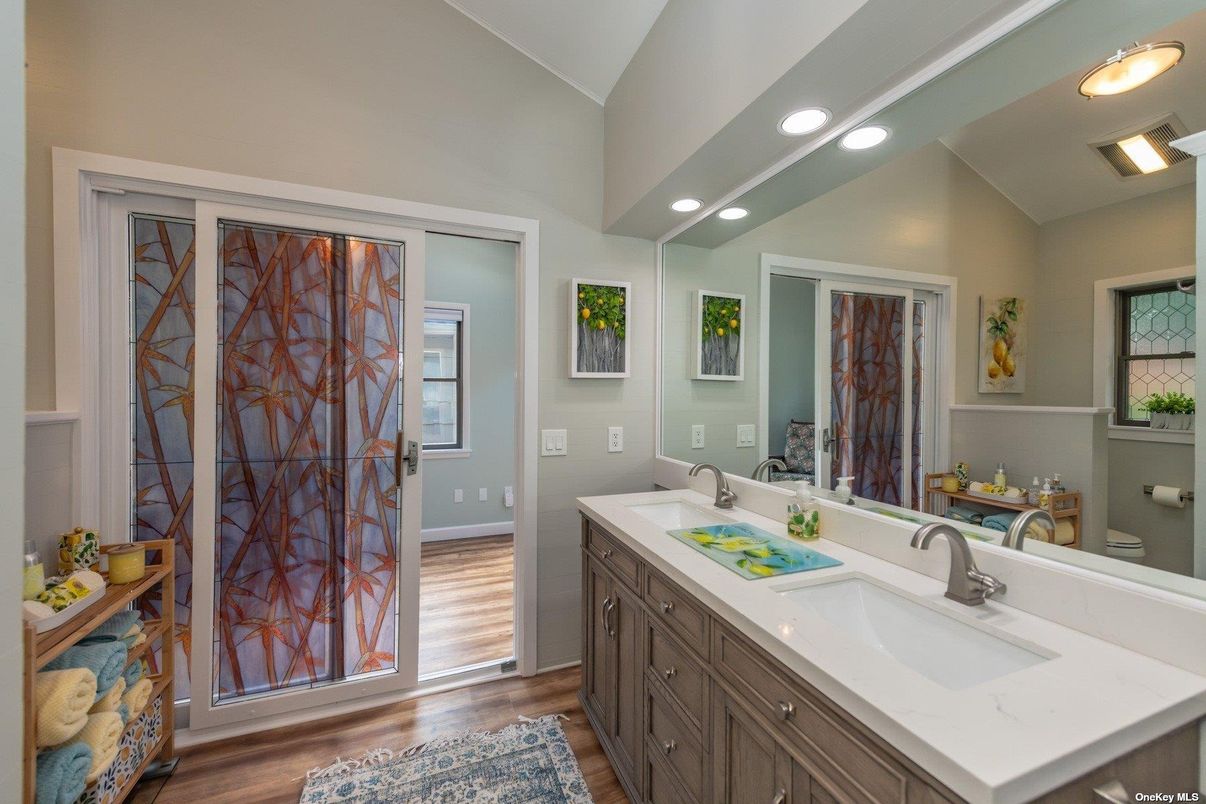 Bathroom, Dual Sink Vanities, Interior, Recessed Lighting, Wood Texture Flooring