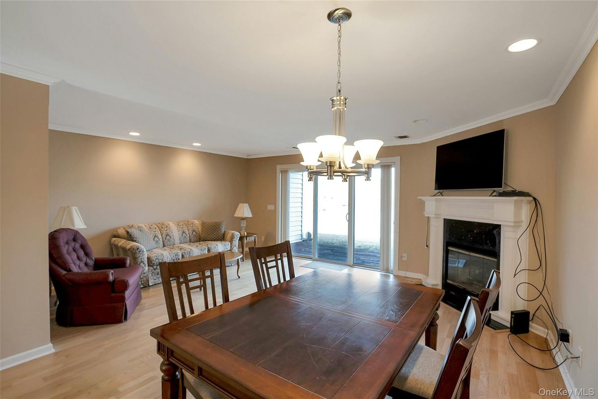 Chandelier, Dining room, Fireplace, Interior, Living room, Recessed Lighting, Wood Texture Flooring