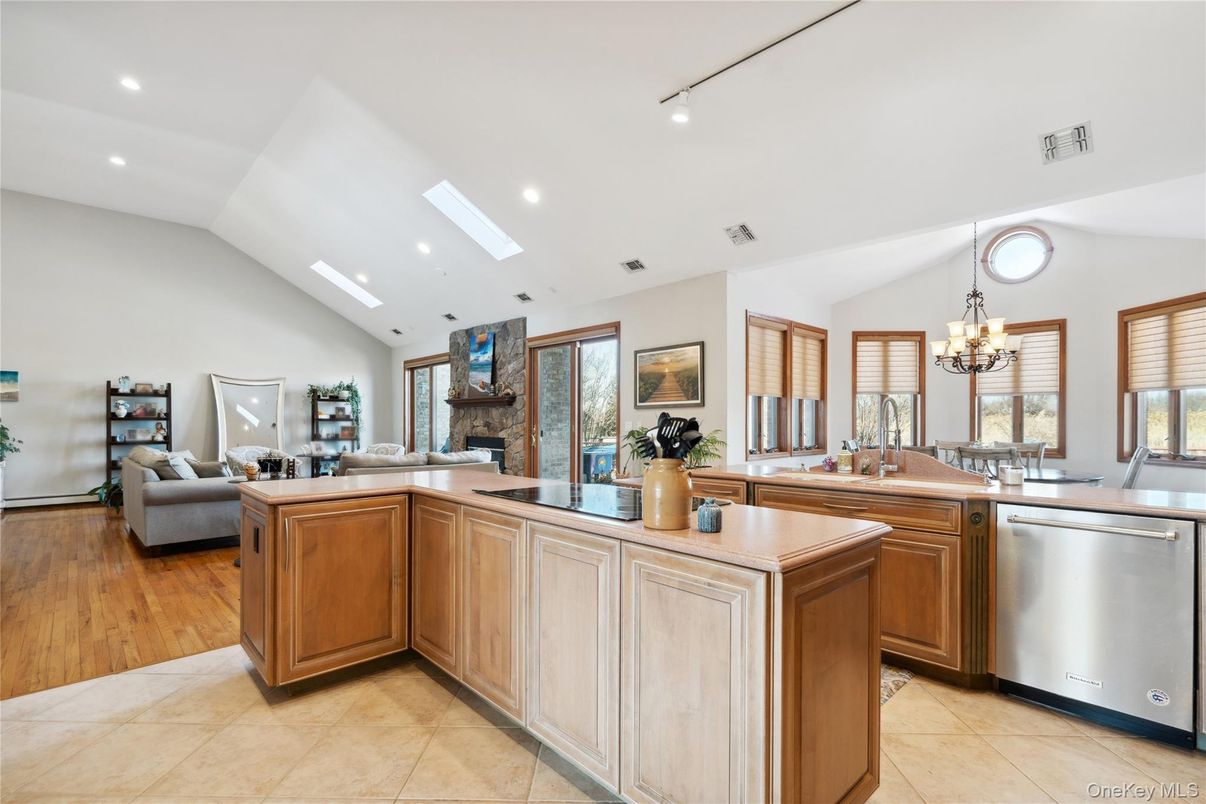 Chandelier, Dining room, Fireplace, Interior, Kitchen, Living room, Recessed Lighting, Wood Texture Flooring