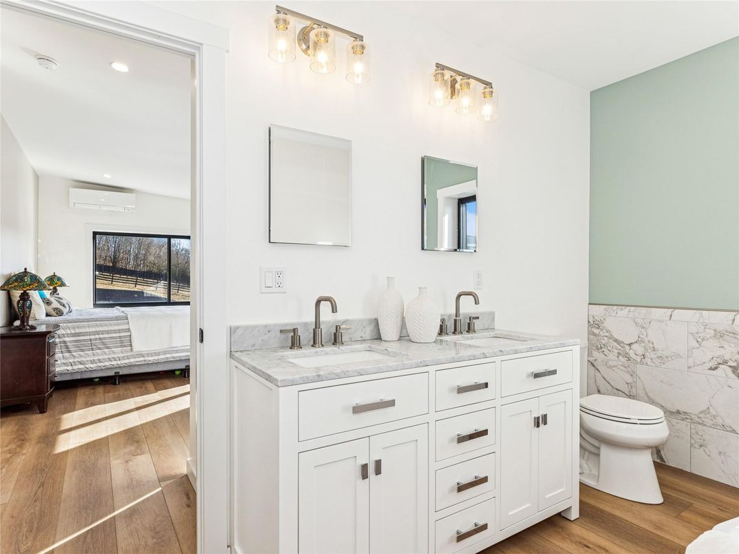 Bathroom, Bedroom, Dual Sink Vanities, Interior, Marble Walls, Recessed Lighting, Wood Texture Flooring