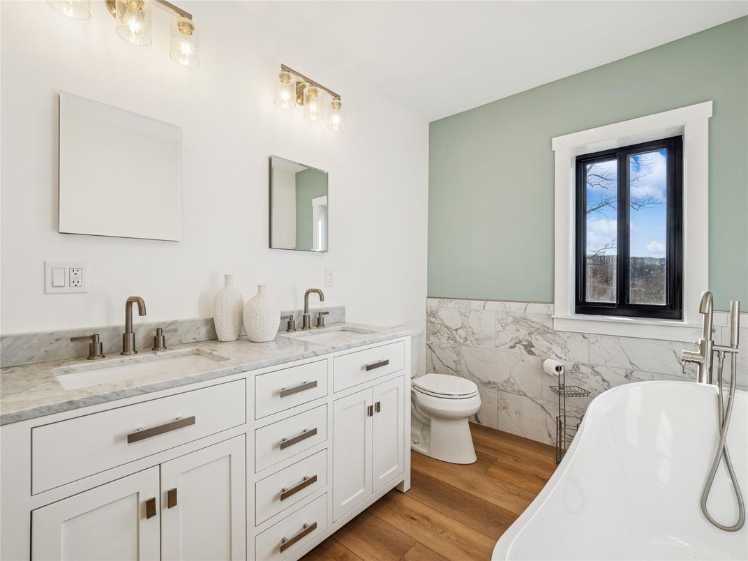 Bathroom, Dual Sink Vanities, Free Standing Baths, Interior, Marble Walls, Wood Texture Flooring
