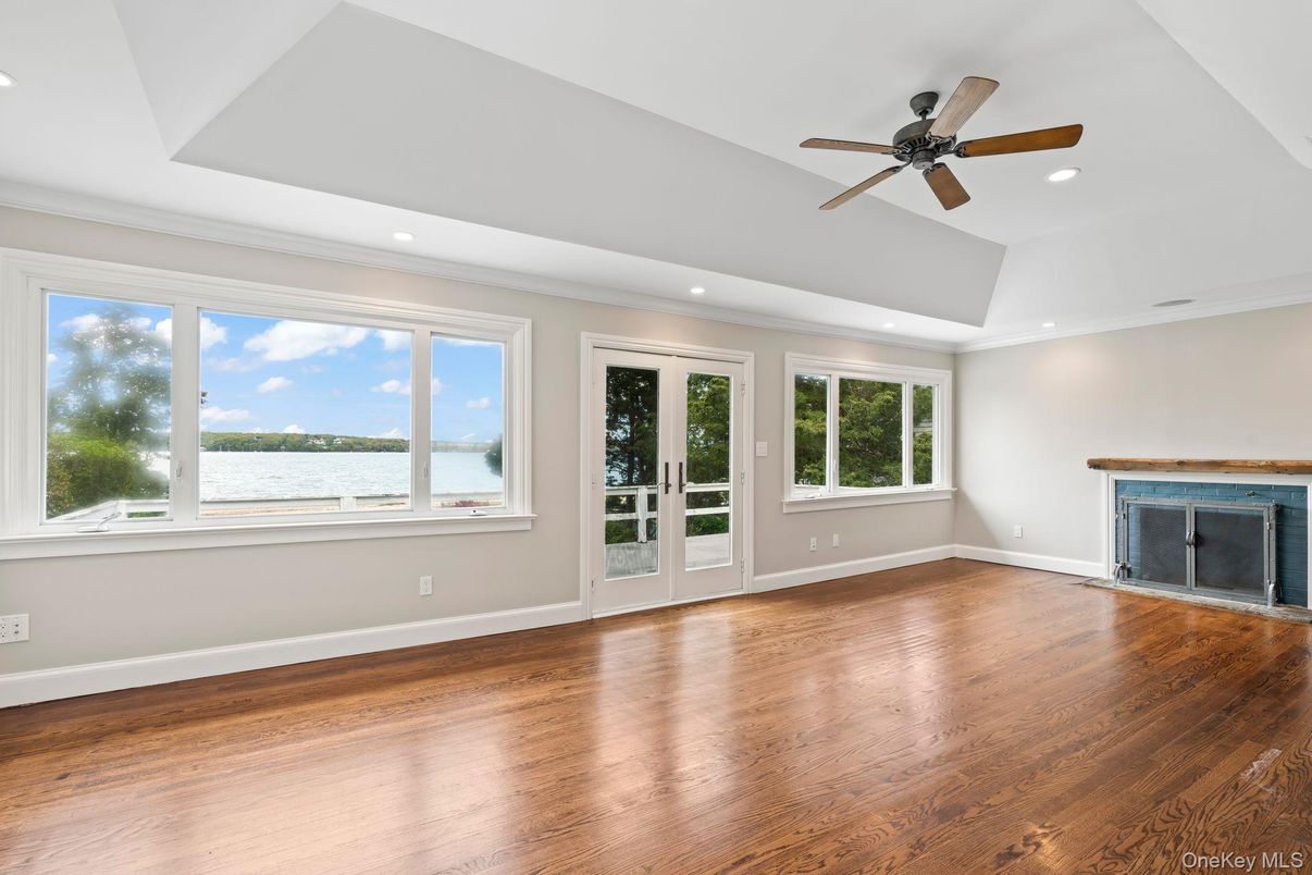 Empty room, Fireplace, Interior, Recessed Lighting, Water, Wood Texture Flooring