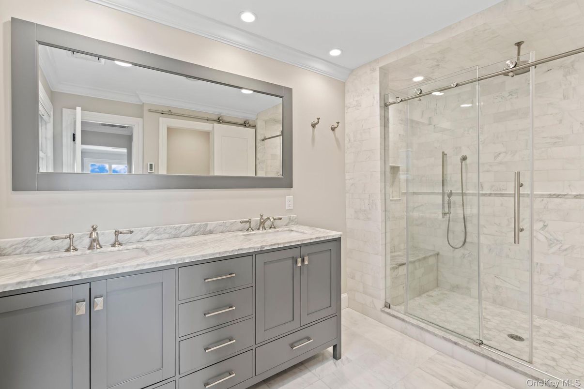 Bathroom, Dual Sink Vanities, Glass Shower, Interior, Marble Walls, Recessed Lighting