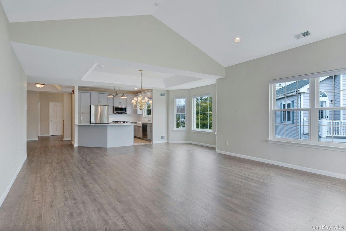 Chandelier, Empty room, Interior, Kitchen, Pendant Lights, Recessed Lighting, Stainless Steel Appliances, Wood Texture Flooring