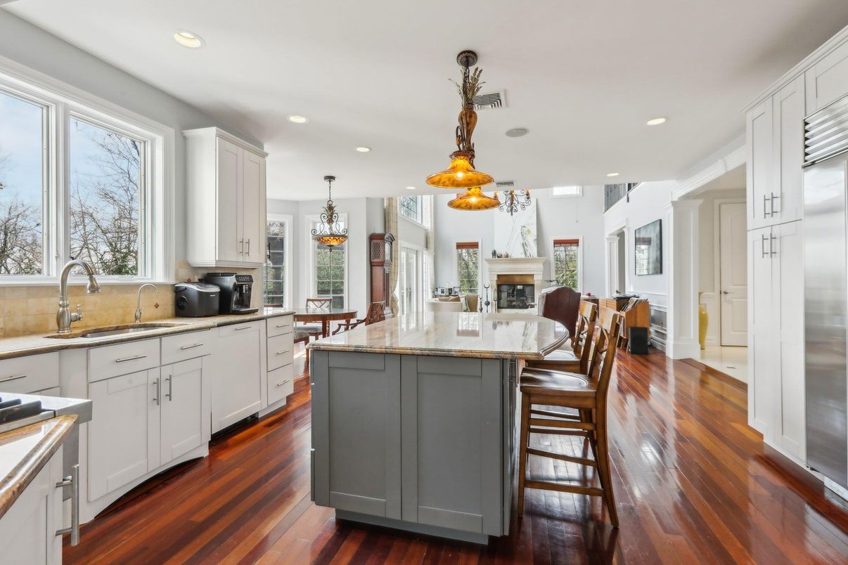 Dining room, Fireplace, Interior, Kitchen, Pendant Lights, Recessed Lighting, Stainless Steel Appliances, Wood Texture Flooring