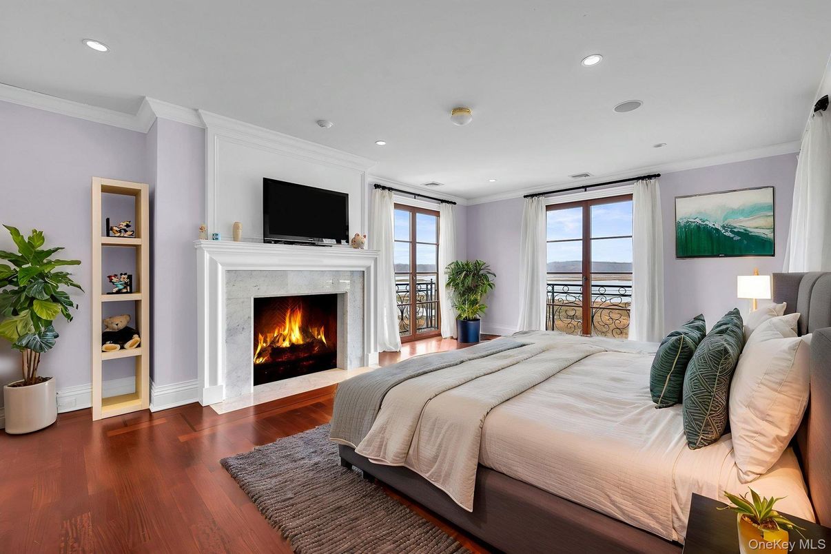 Bedroom, Fireplace, Interior, Recessed Lighting, Water, Wood Texture Flooring