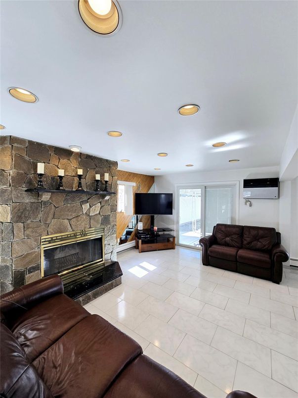 Fireplace, Interior, Living room, Marble, Recessed Lighting, Stone Walls