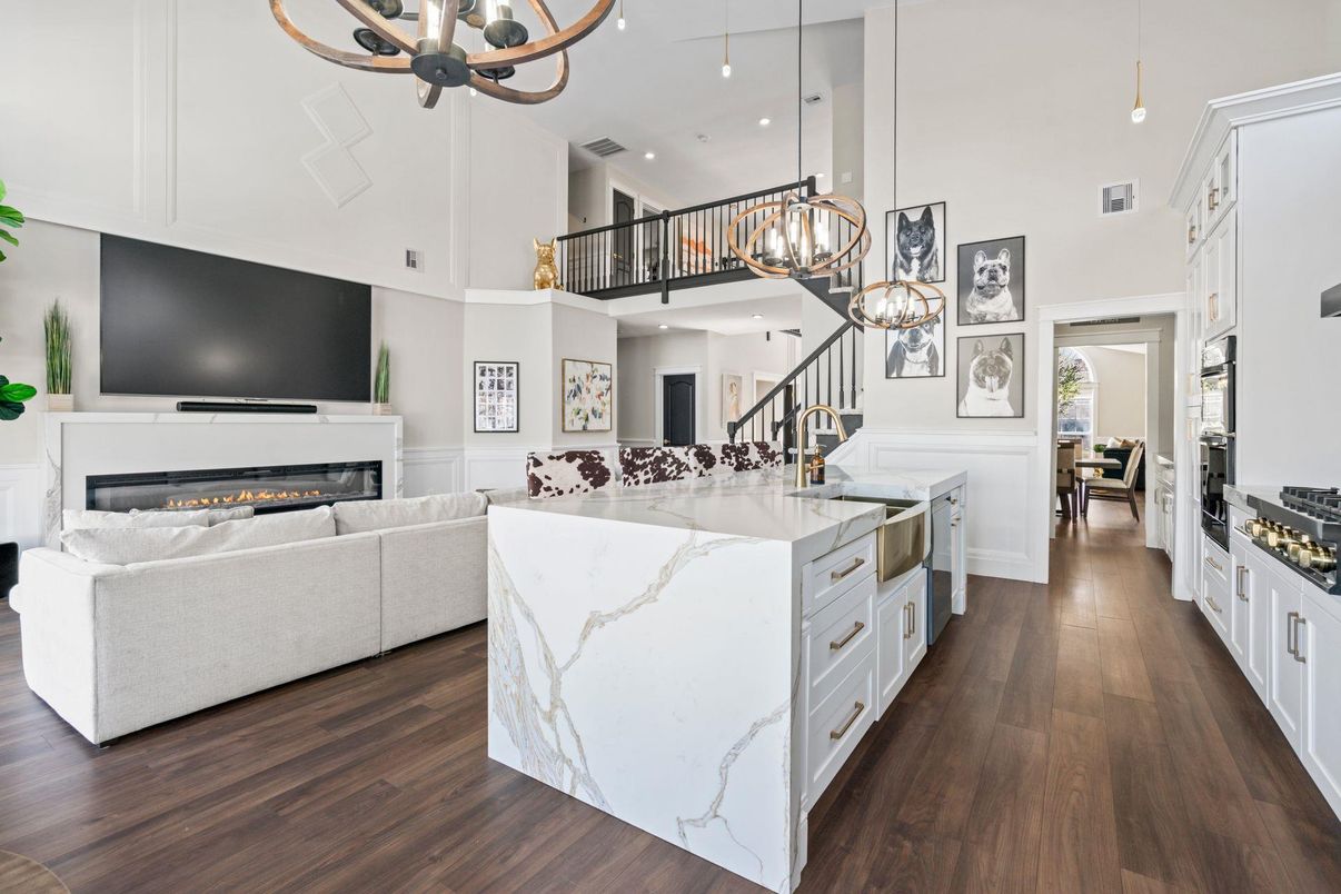 Chandelier, Fireplace, Interior, Kitchen, Living room, Pendant Lights, Recessed Lighting, Wood Texture Flooring