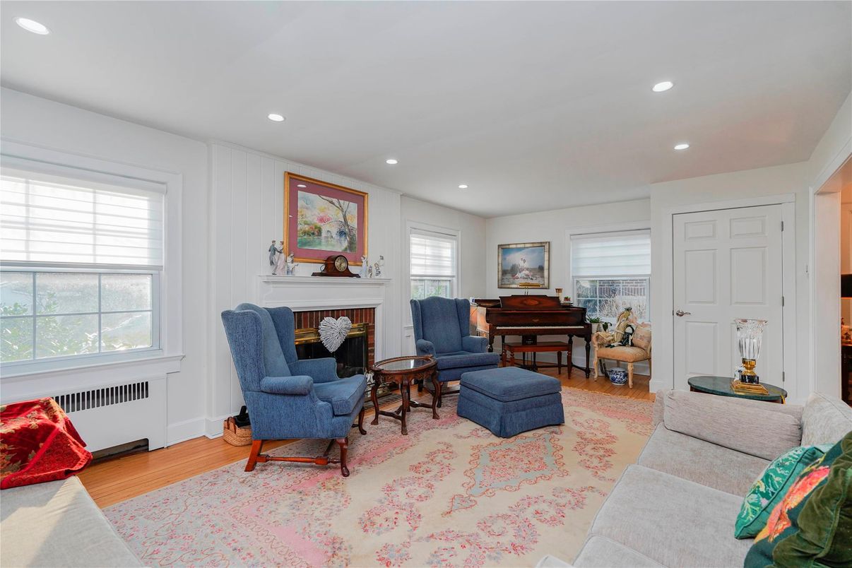 Fireplace, Interior, Living room, Piano, Recessed Lighting, Wood Texture Flooring