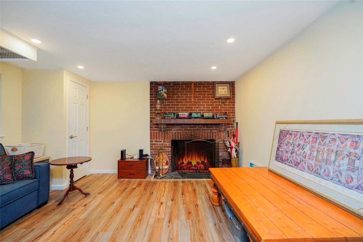 Fireplace, Interior, Recessed Lighting, Stone Walls, Wood Texture Flooring