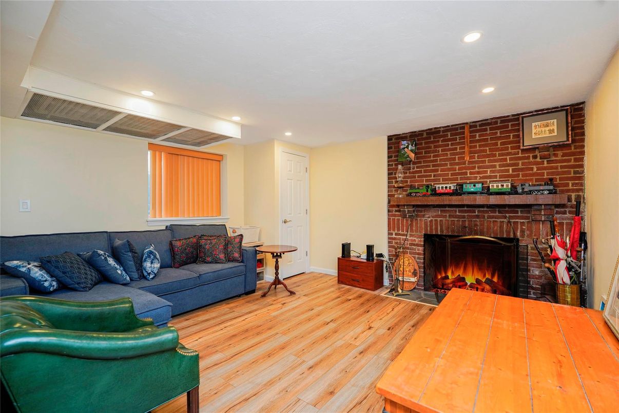 Fireplace, Interior, Living room, Recessed Lighting, Stone Walls, Wood Texture Flooring