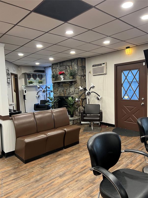 Fireplace, Interior, Living room, Recessed Lighting, Stone Walls, Wood Texture Flooring