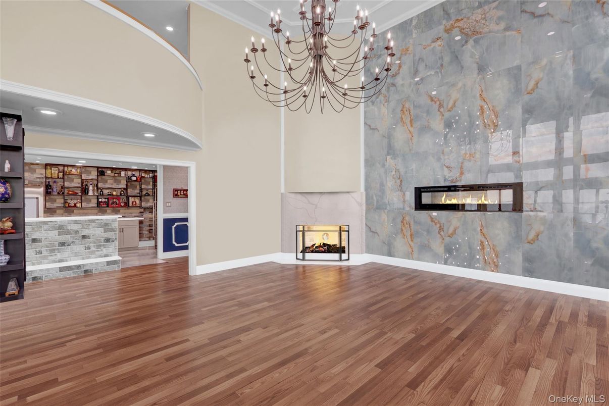 Chandelier, Empty room, Fireplace, Interior, Recessed Lighting, Wood Texture Flooring