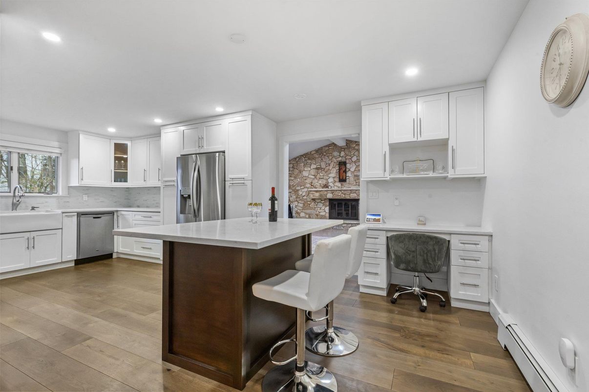 Fireplace, Interior, Kitchen, Recessed Lighting, Stainless Steel Appliances, Stone Walls, Wood Texture Flooring